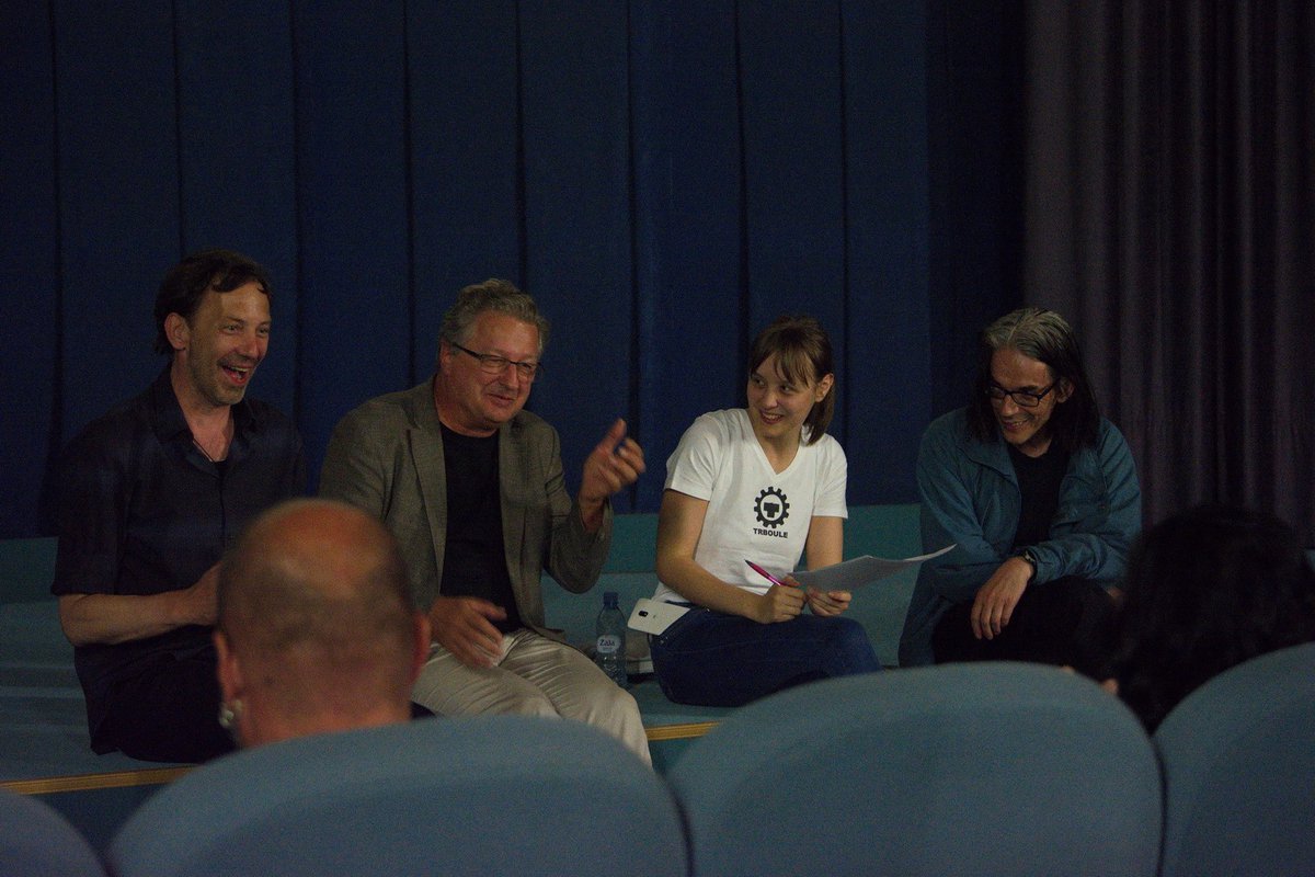 Film director Igor Zupe, current Laibach bandleader Ivan "Jani" Novak, moderator Kaja Čop, and Dejan Knez (all from Slovenia), in the talk following the projection of the documentary film on Laibach.
