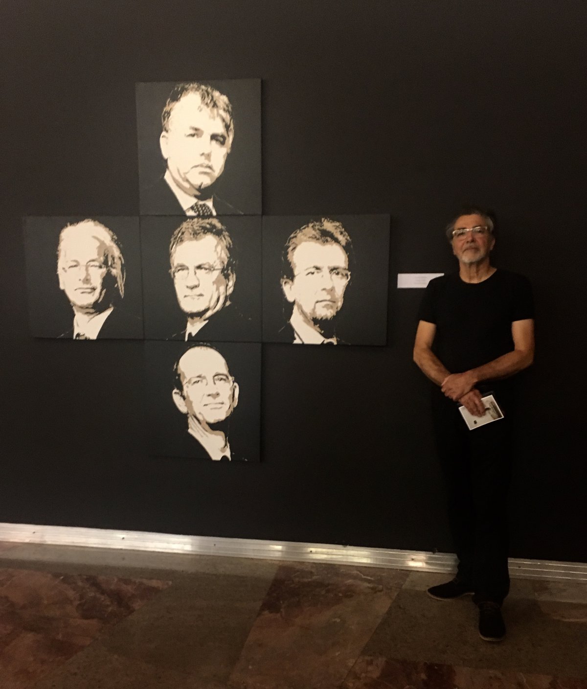 Matjaž Stopar (Slovenia) in front of his painting of the IRWIN group members' portrait.